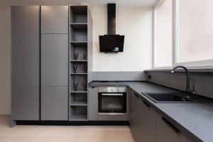 granite worktops among grey kitchen cabinets